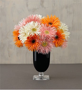 multicolored gerbera in art deco glass vase