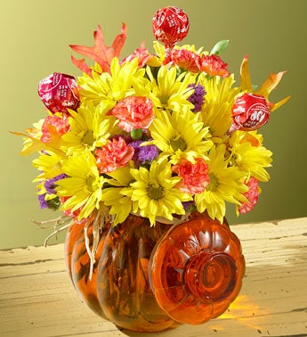 flowers in pumpkin container