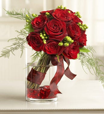 /one dozen red roses in cylinder vase with ribbon